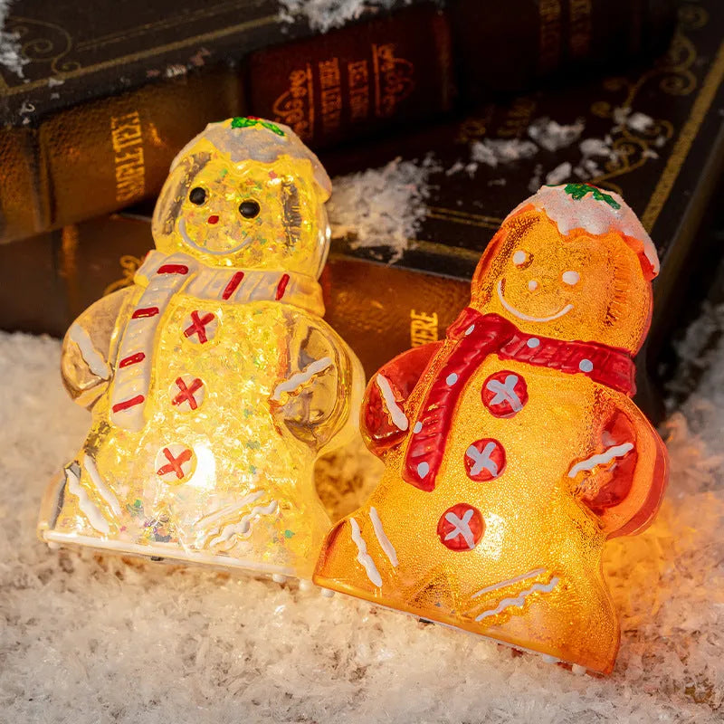 Glowing plastic gingerbread man snowman Christmas ornament with a choice of scarf colours on a festive background.