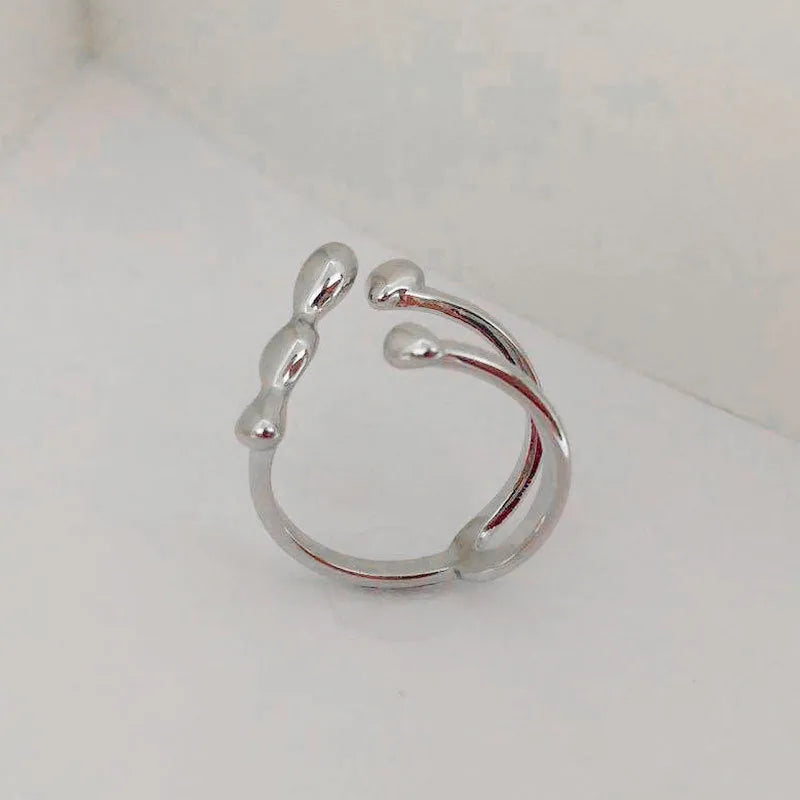 Brass women's fashion ring with spherical design in gold or silver colour