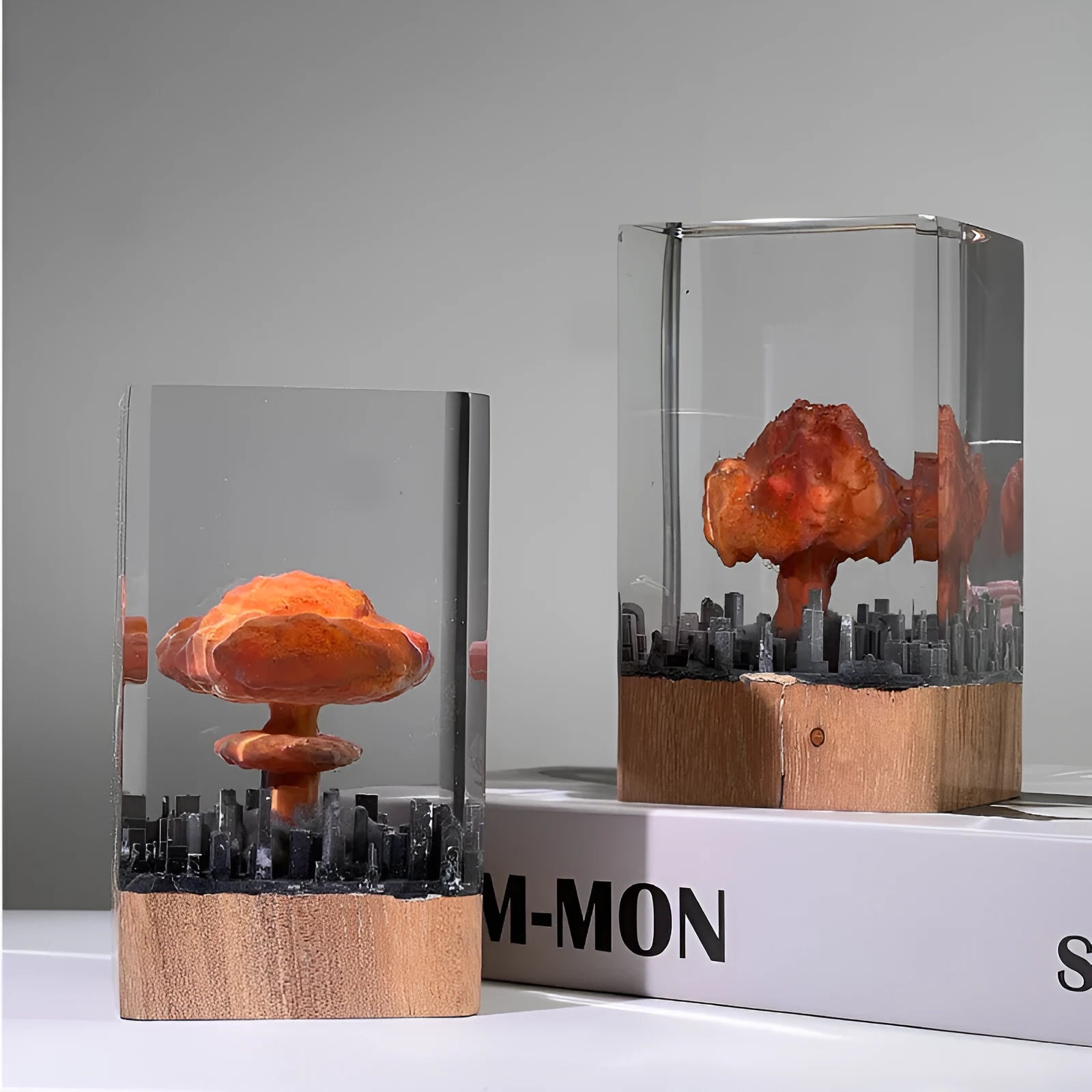 Small resin atomic bomb mushroom cloud night lamp ornament on a desk.