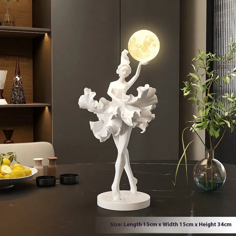 Ballet dancer resin night lamp in pink placed on a hallway table