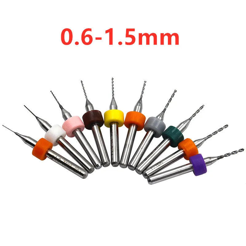 Ten tungsten carbide PCB drill bits with straight shanks on a white background