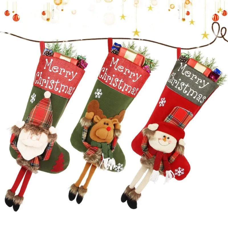 Three large Christmas stockings with Santa, Snowman and Reindeer 3D designs hanging for holiday decoration