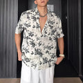 Men's loose fit short sleeve shirt with floral print in black or white colour options