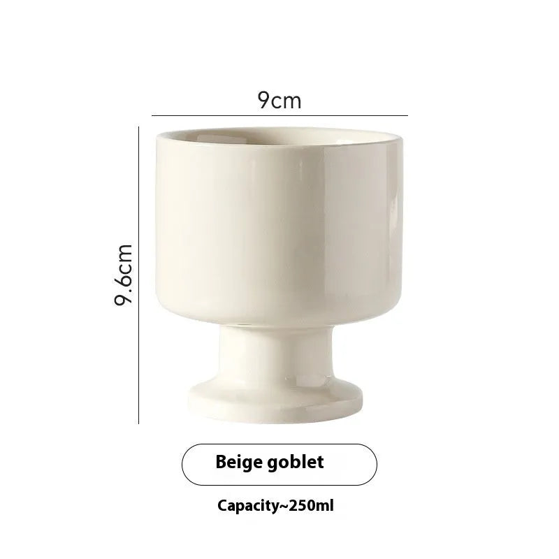 Hand-pinched irregular ceramic mug showing solid colour and unique shape