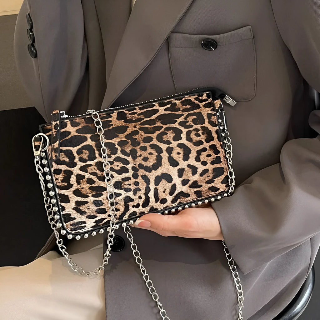 Women's square crossbody bag in PU leather with chain detail, shown in dark brown colour