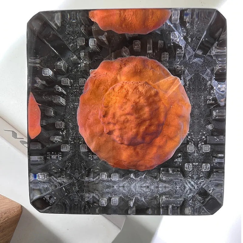 Small resin atomic bomb mushroom cloud night lamp ornament on a desk.