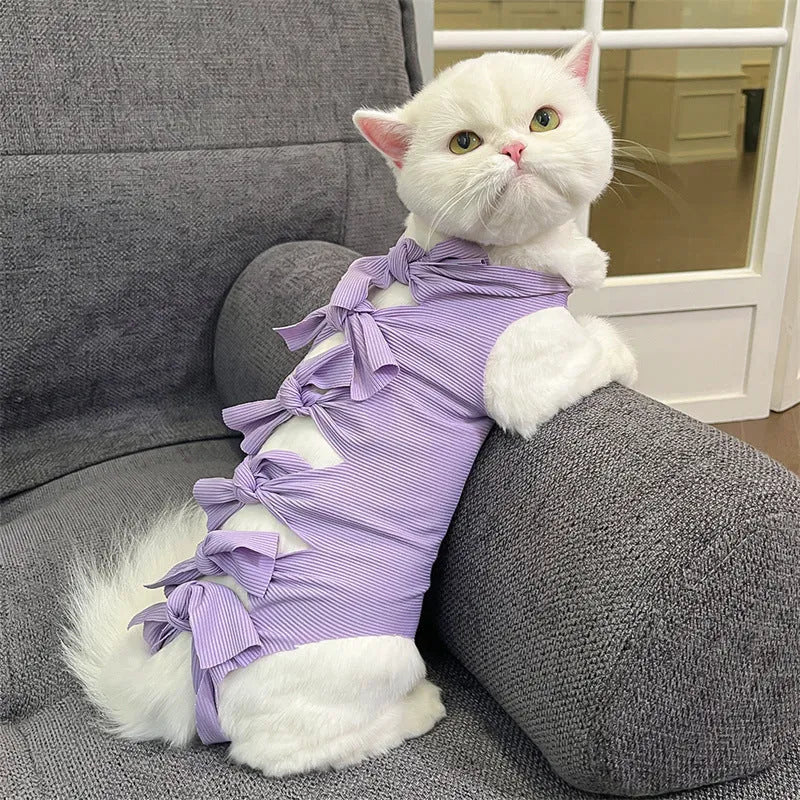 Blue lace-up polyester sterilisation clothing for a cat, shown on a size chart for S, M, and L.