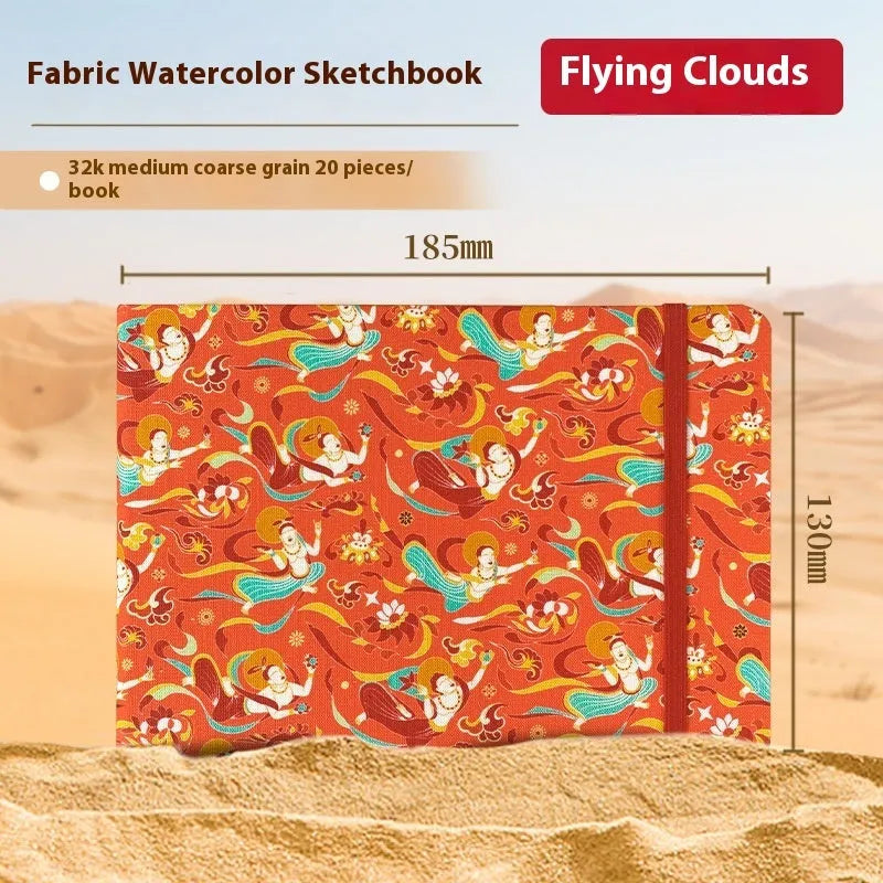 Feiluniao handmade fabric watercolour notebook with illustrated cover, open to show blank paper pages.