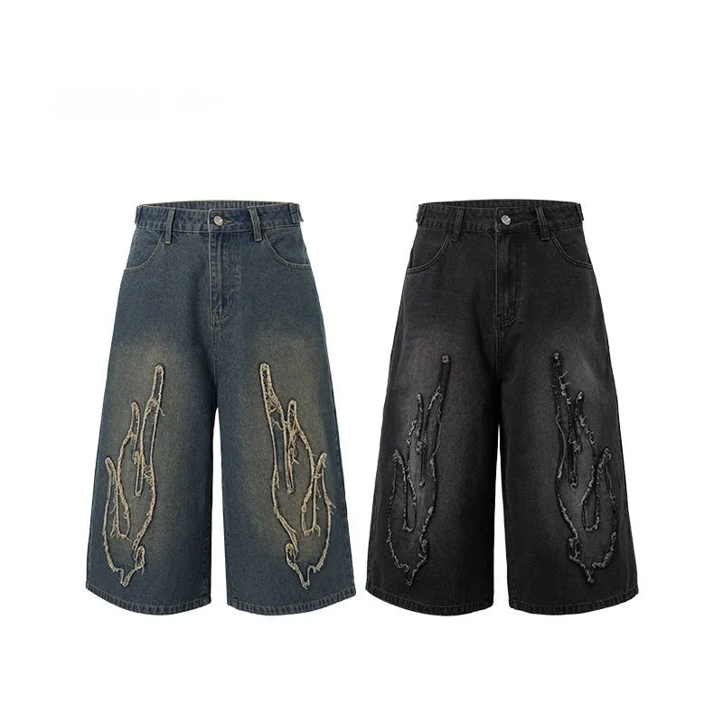Men's black denim shorts with flame embroidery patch, cropped straight leg style