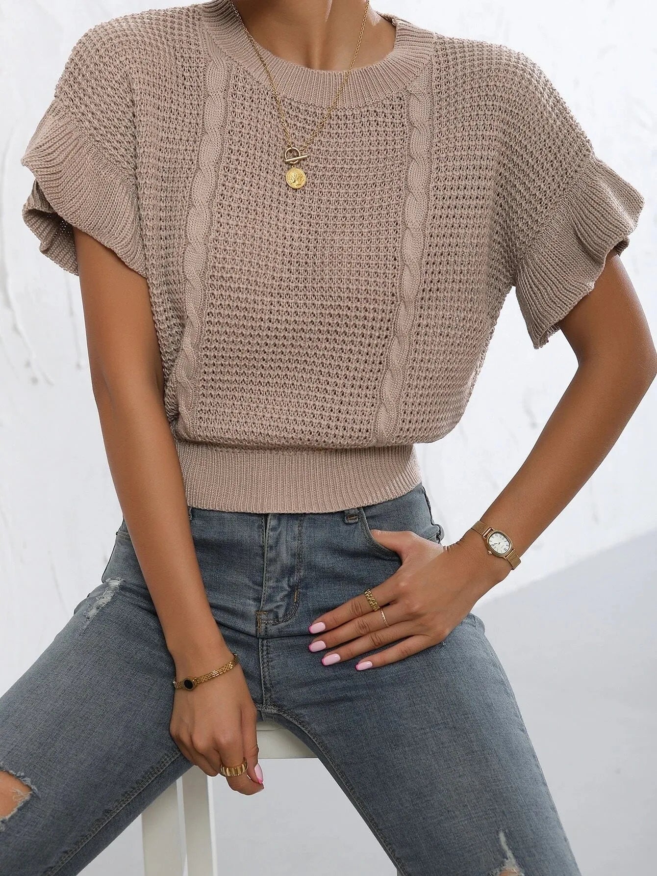 Twisted string design knitted pullover sweater with ruffled short sleeves in loose fit.