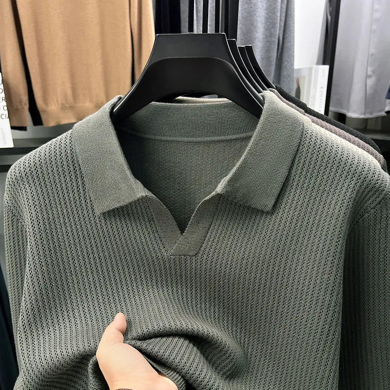 Men's loose fit casual green pullover sweater for autumn layering on a hanger.
