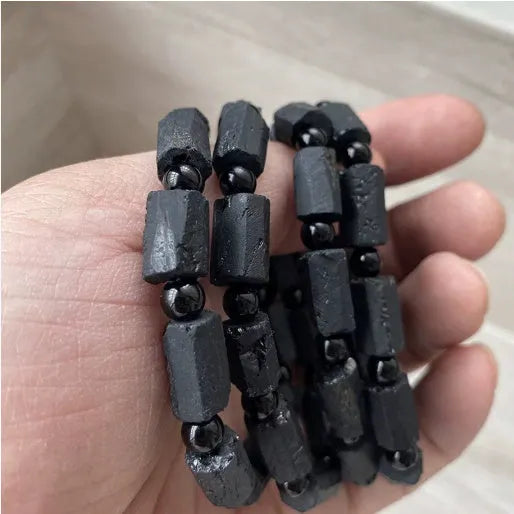 Black tourmaline rough stone bracelet with natural textured beads measuring 8.5-9mm and adjustable closure
