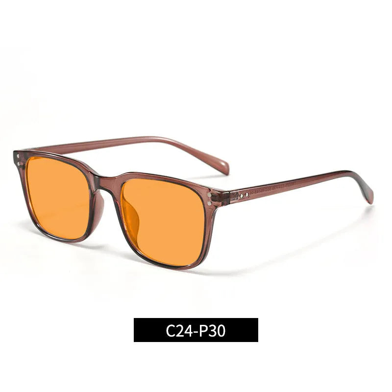 Colour-changing orange lens anti-blue light glasses with a TR90 frame on a colour box.