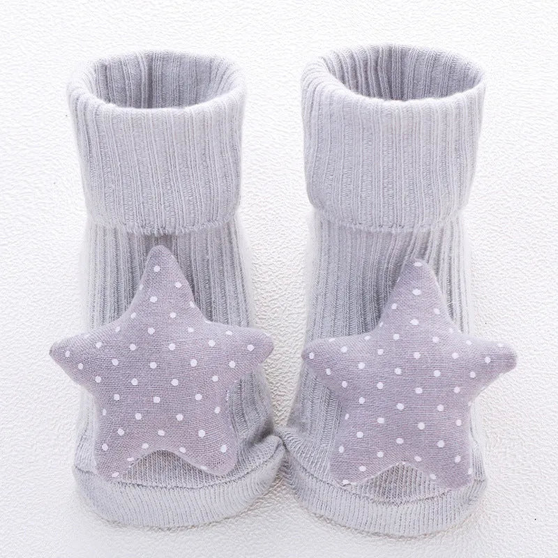 Cotton baby floor socks in multiple designs including panda, bow, and star patterns.
