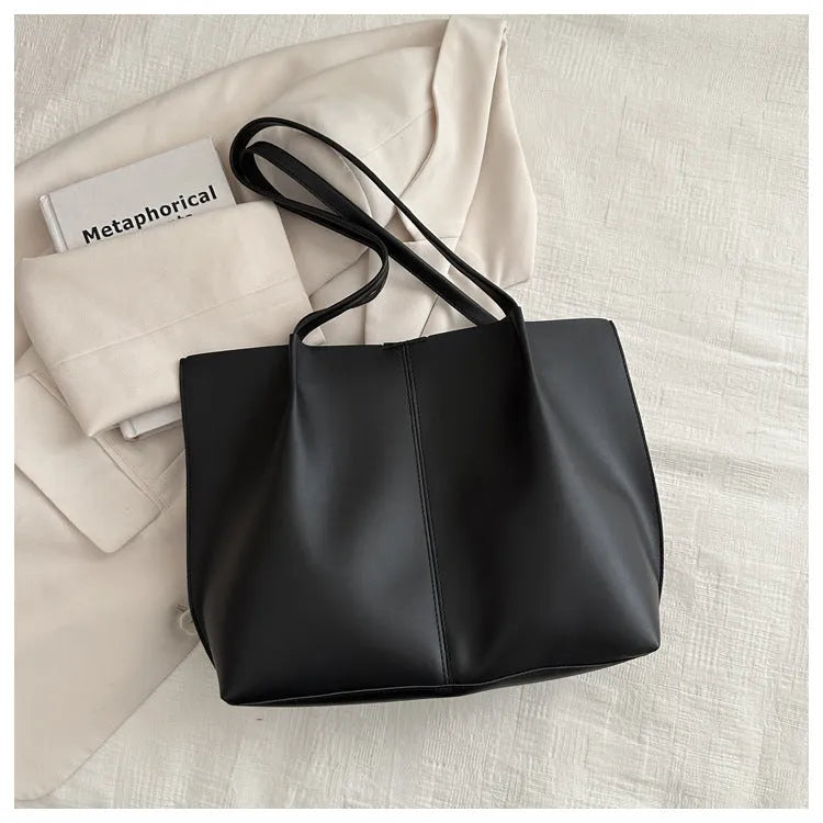 Casual messenger bag in PU leather with stitched detail, bucket shape, double shoulder straps, available in black brown coffee white