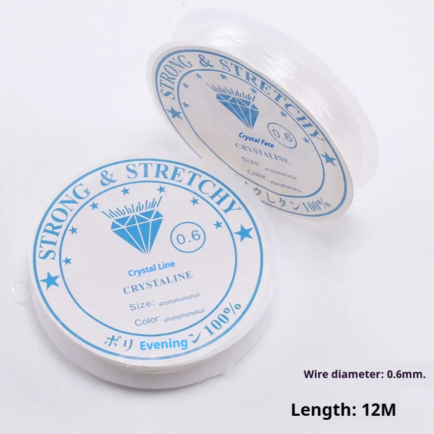 Coil of transparent white elastic fishing line cord for DIY jewellery and ornament making.