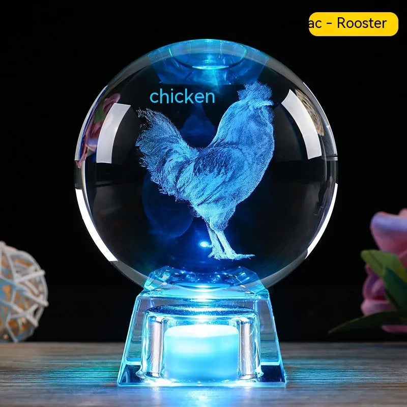 White crystal ball zodiac ornament with luminous electronic base showing Chinese animal designs