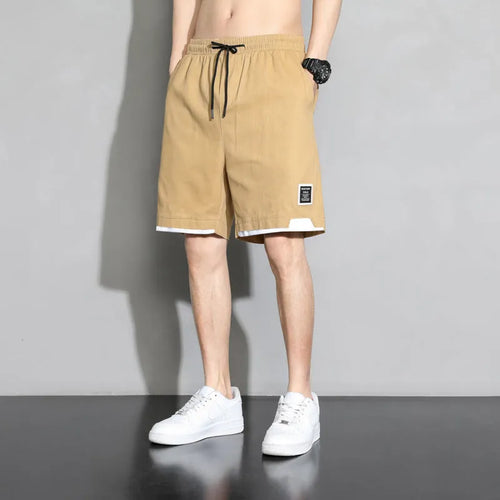Boy wearing black cotton plus-size shorts with a mid-waist and casual overalls style.