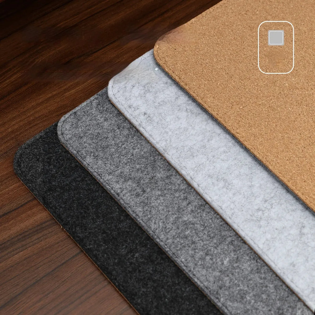 Felt cork desk mat in black gray pattern on a wooden desk with a mouse and keyboard