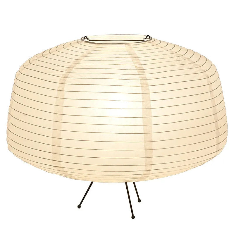Japanese style xuan paper desk lamp on a wooden desk with soft warm light