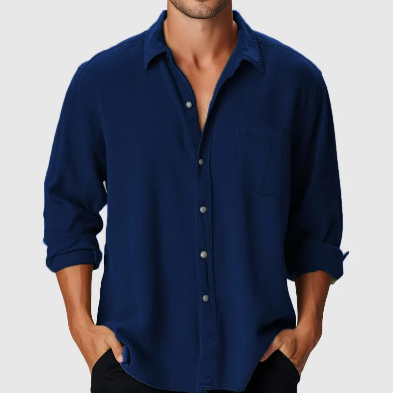 Man wearing a pure colour loose-fit polyester holiday shirt with a stand collar and long sleeves.