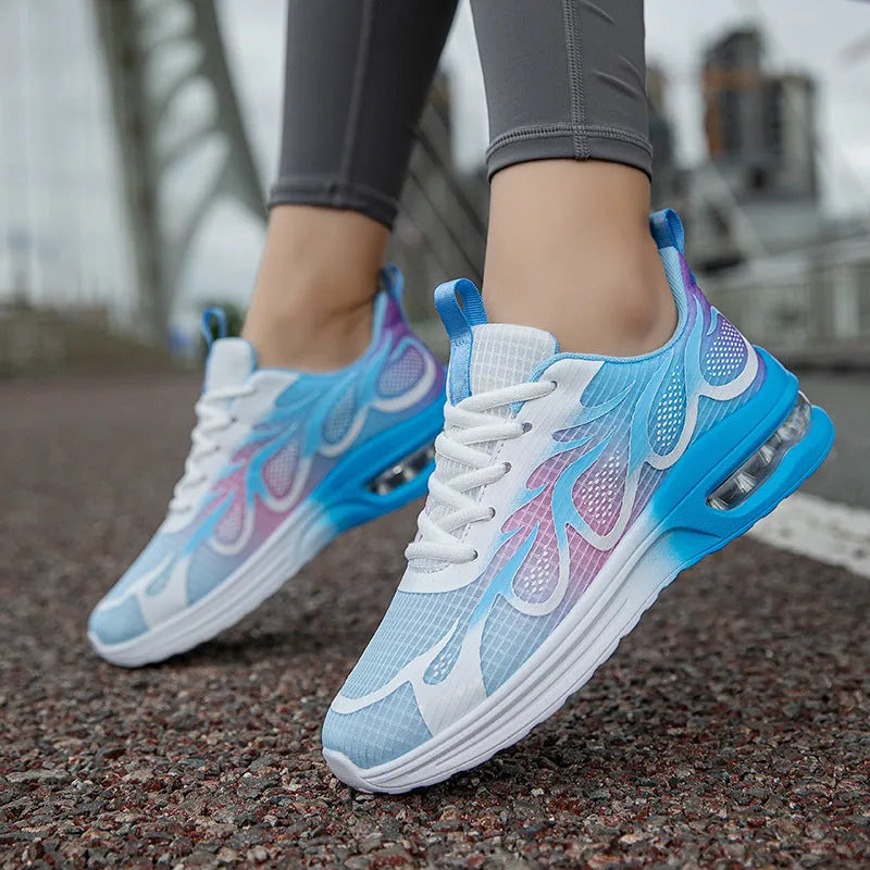 Women's pink mesh and PU sole casual sneaker shown from the side.