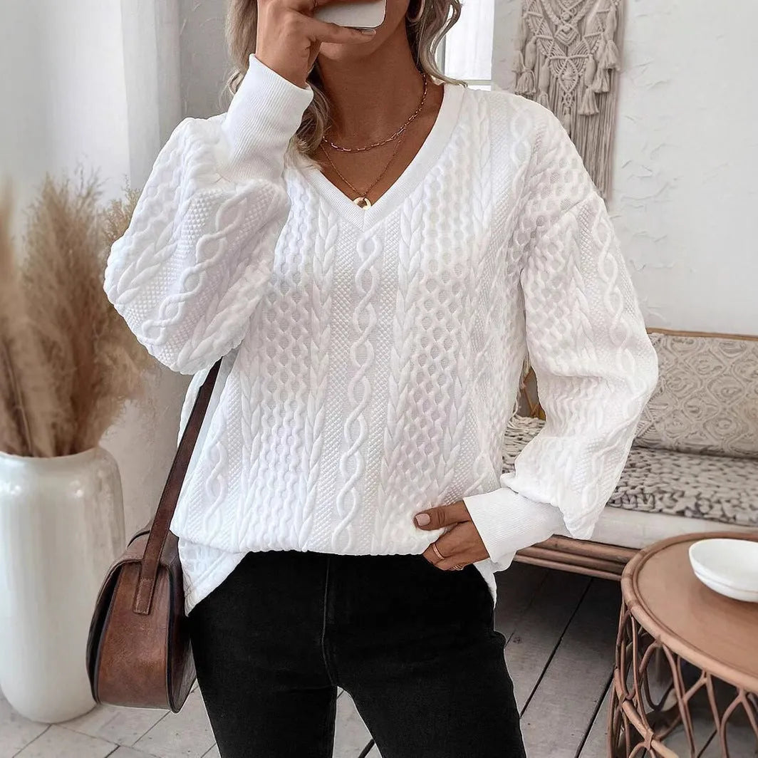 Milky white loose fit long sleeve T-shirt with a raised 3D pattern on the front.