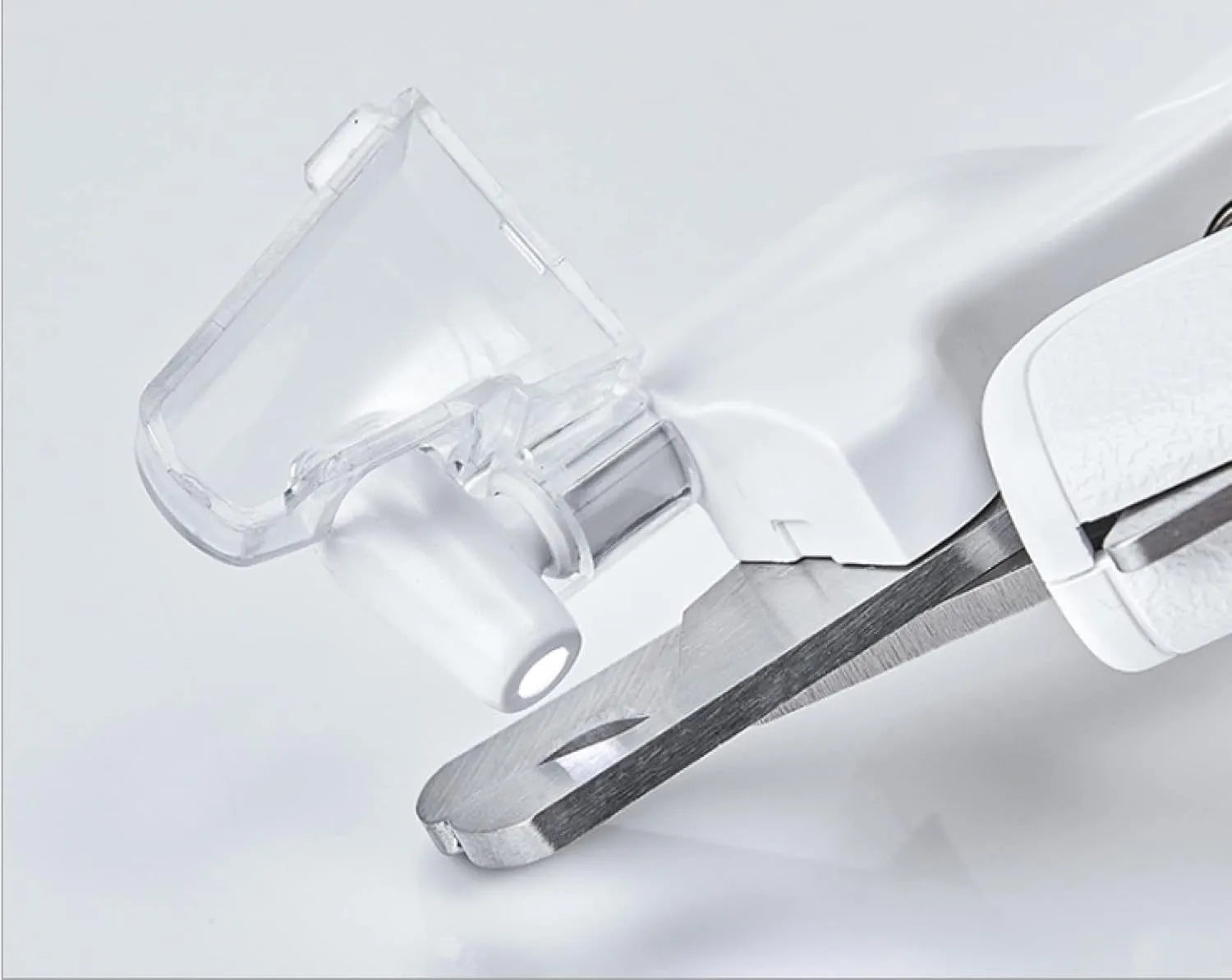 White LED pet nail clipper for cats and dogs with transparent anti-splash guard and file.