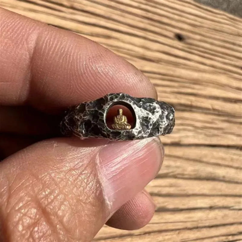 Hand-forged copper Grotto Buddha ring with rock texture on a size No. 8 finger.
