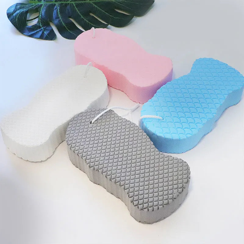 3D fish scale pattern bath sponge in white, grey, pink and light blue colours for body exfoliation