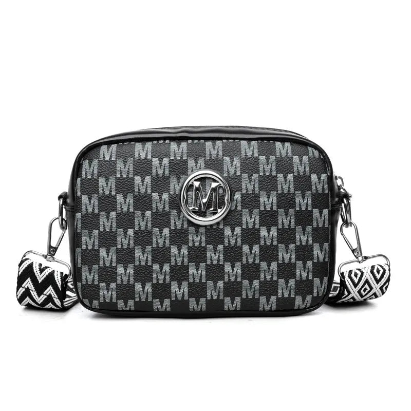 Black wide-strap crossbody bag made of PU leather, showing the three-dimensional outer pocket and adjustable shoulder strap.