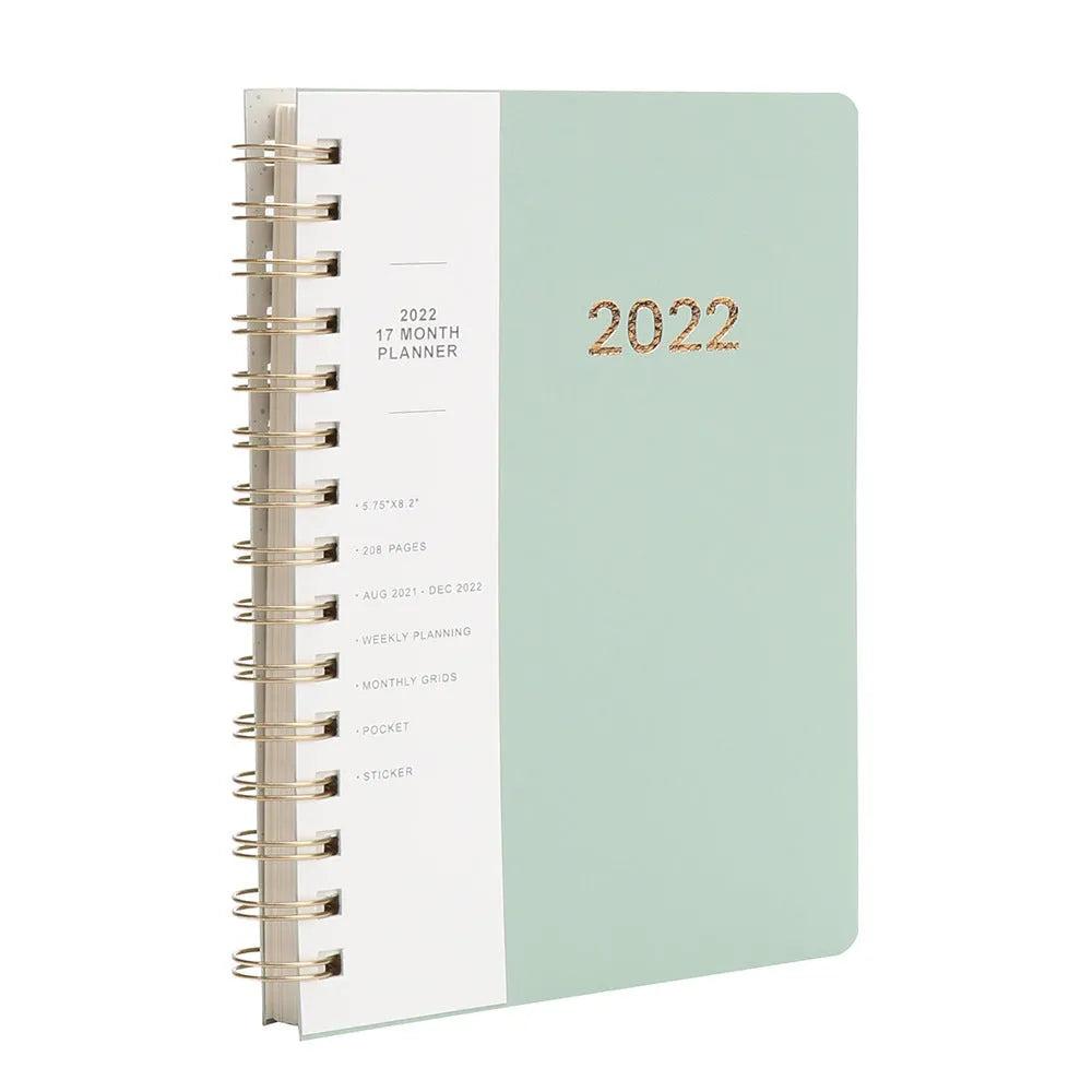 Blue 17-month 2022-2023 student planner with coil binding, month grid, and pockets.
