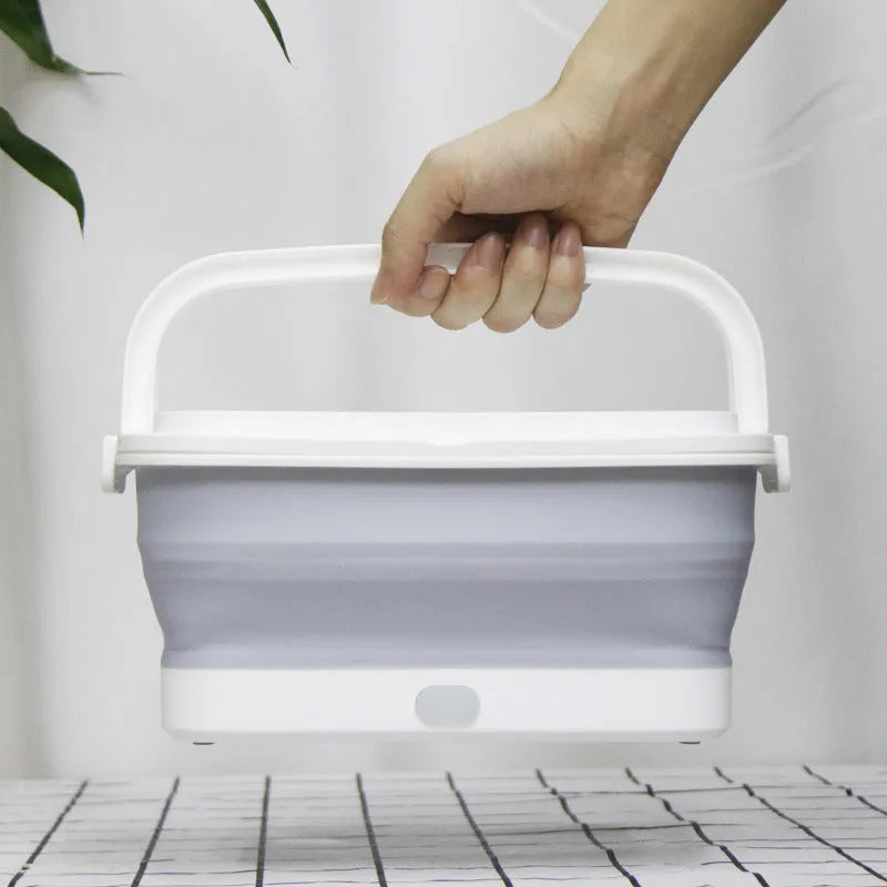 Foldable UV disinfection box with aromatherapy and drying function on a table