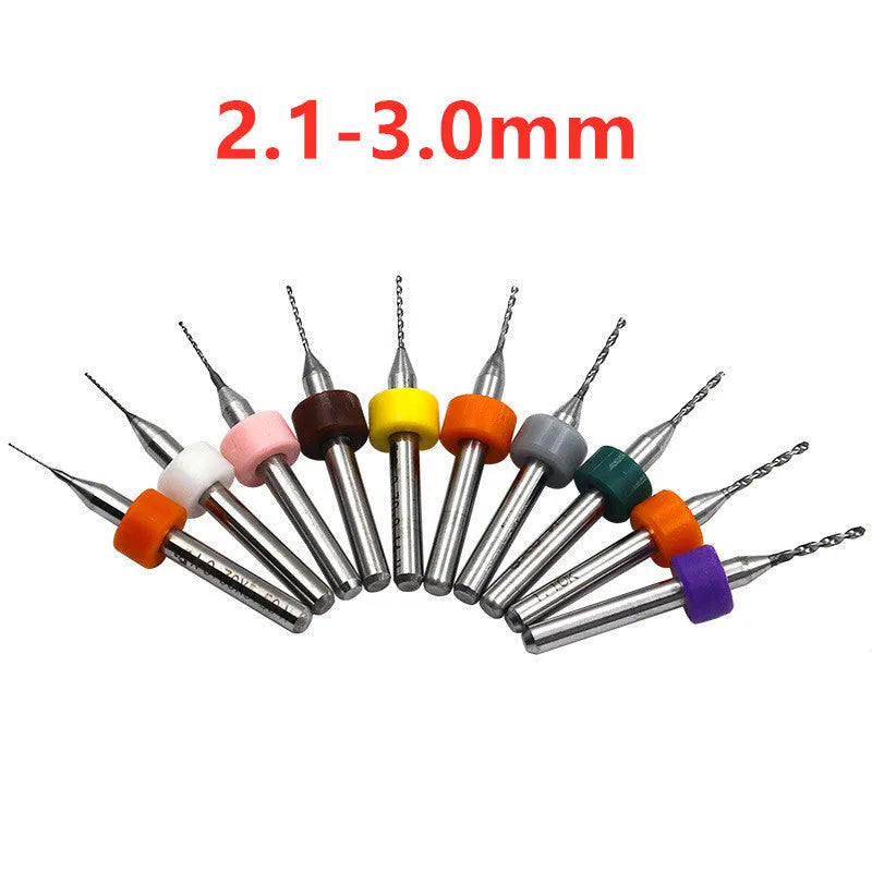 Ten tungsten carbide PCB drill bits with straight shanks on a white background