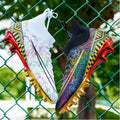 High-top football training shoes in mandarin duck colour with gold-plated PVC sole and lace-up closure