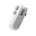 Blue and white handheld USB rechargeable heat sealer with magnetic back on a metal surface.
