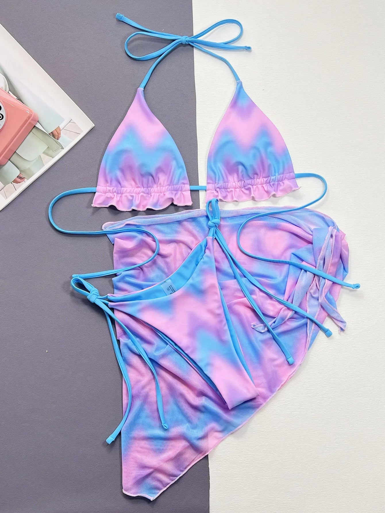 Women's tie-dye bikini swimsuit set with matching high-waisted skirt