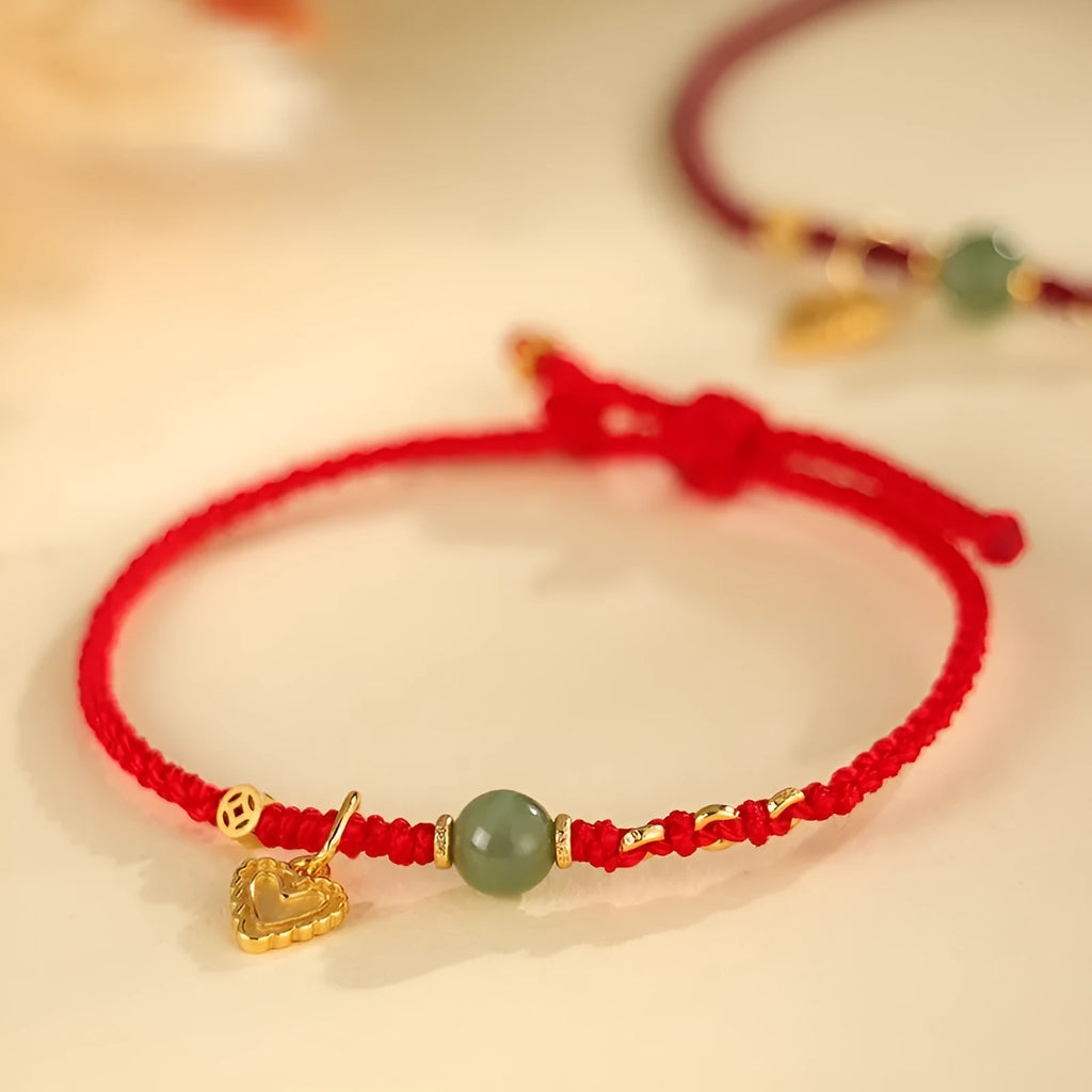 Handmade women's bracelet woven from 925 silver and red Hetian jade with carrying strap.