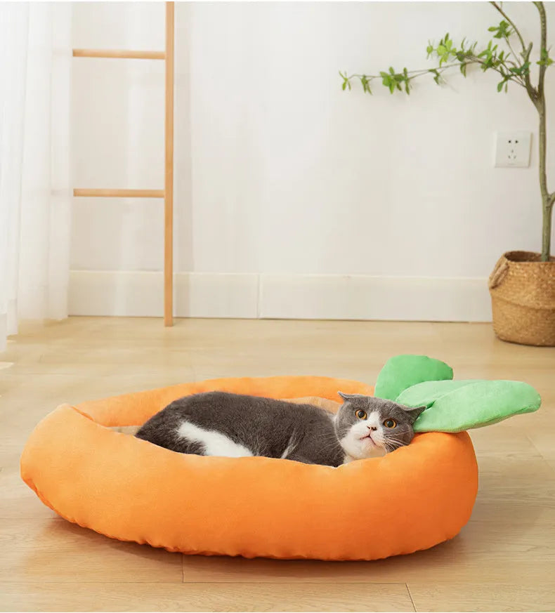 Carrot-shaped nesting dog bed with raised sides and a soft, washable blanket for small and medium pets