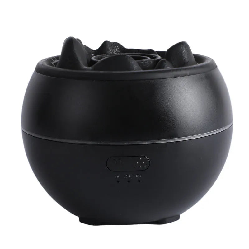 White round flame aroma diffuser humidifier with timer settings on a desk.