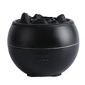 White round flame aroma diffuser humidifier with timer settings on a desk.