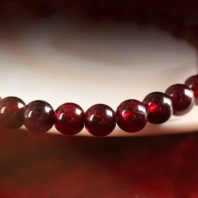 Chinese style gourd bracelet with imitation garnet stones and cultural motifs including Fu character design