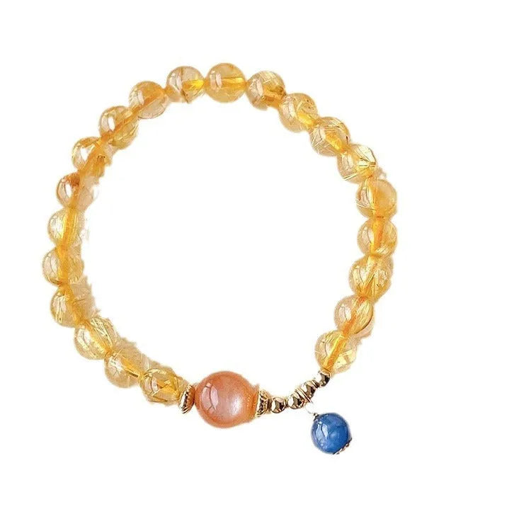 Women's gold rutilated quartz sunstone crystal bracelet with diamond beads