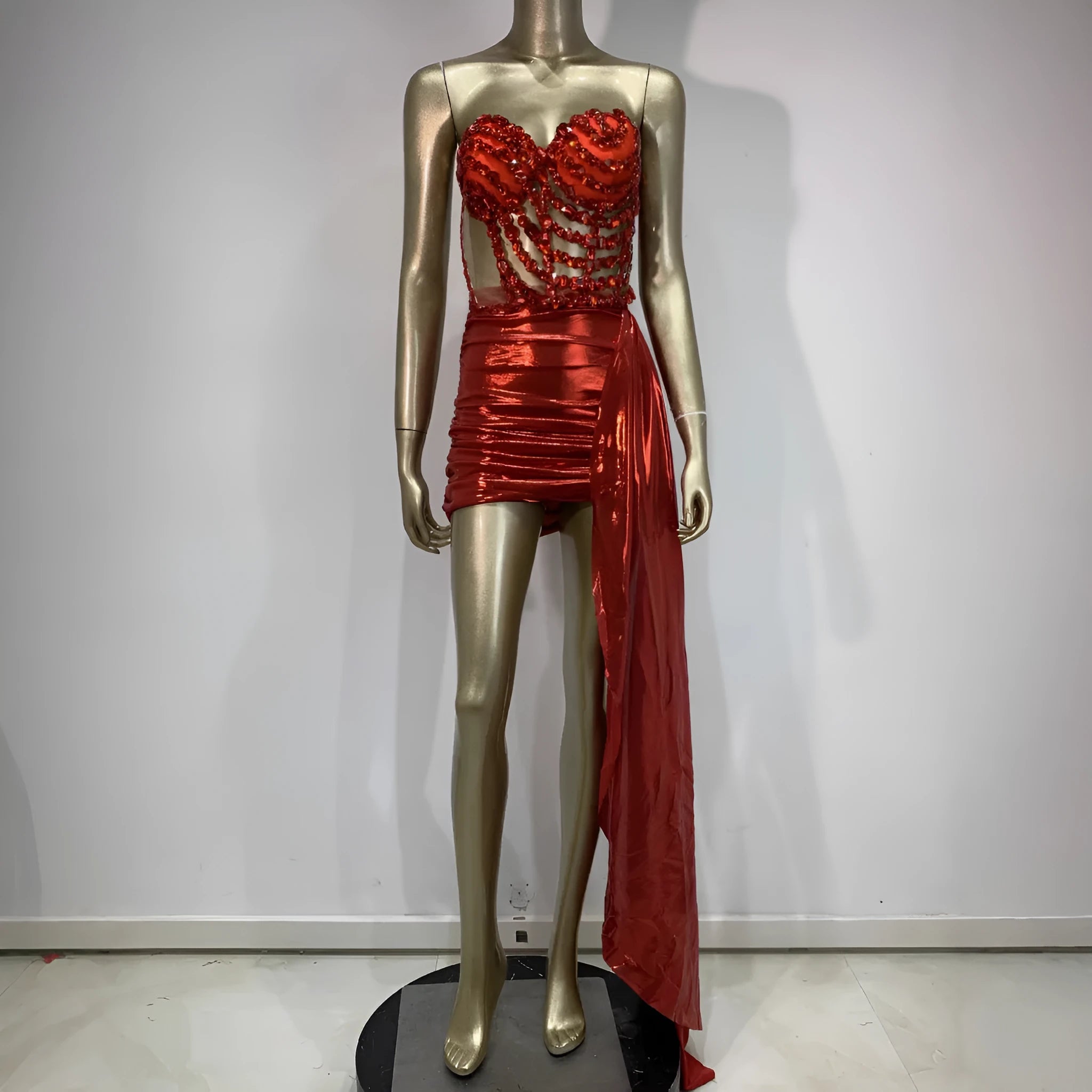 Red female skirt suit with hollow mesh see-through panels, a stage and party costume made from spandex.