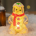 Glowing plastic gingerbread man snowman Christmas ornament with a choice of scarf colours on a festive background.