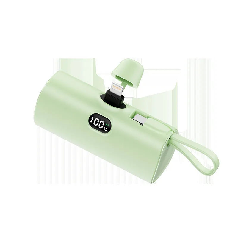 Capsule-shaped digital display power bank with folding plug in multiple colours.