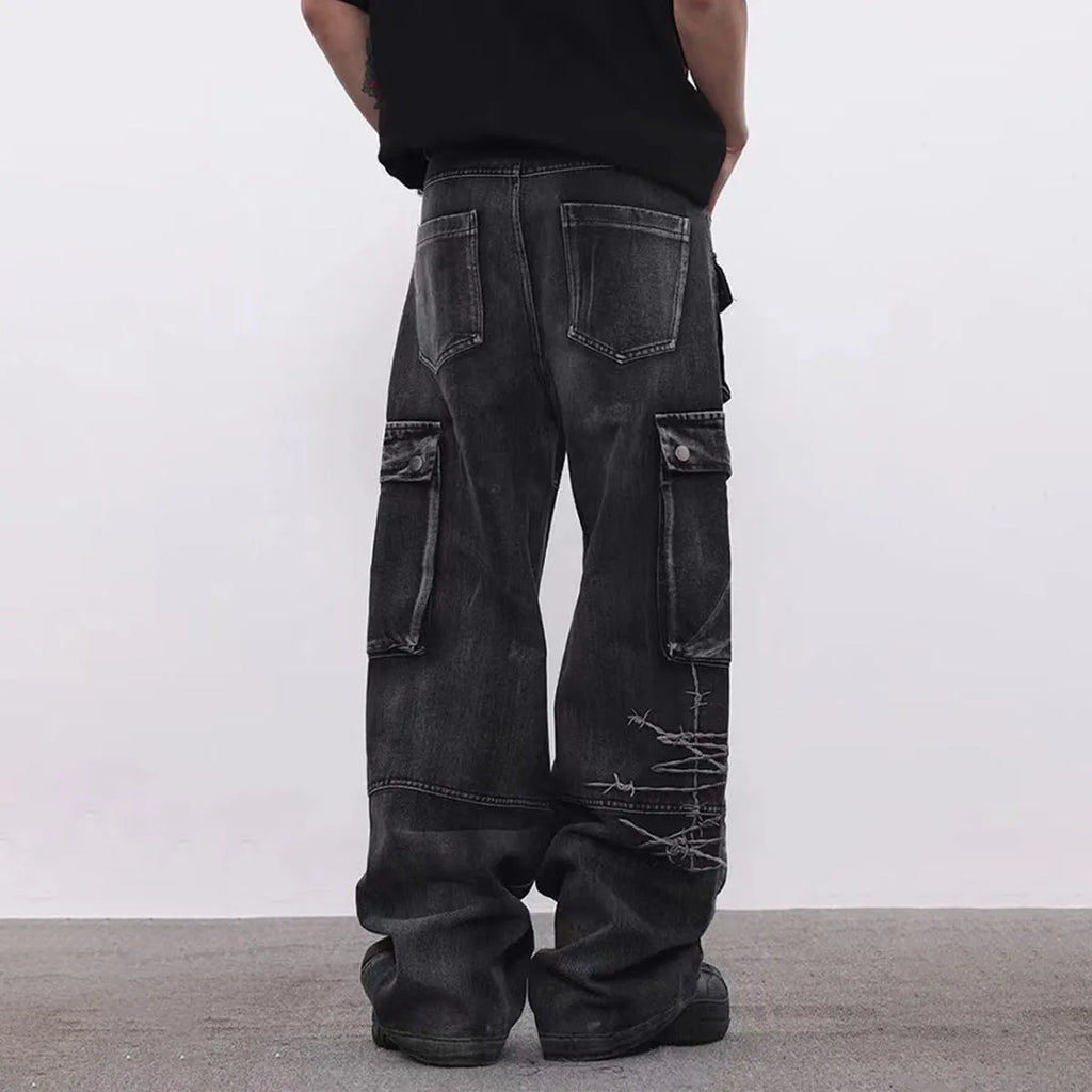 Black men's cotton wide-leg loose-fit trousers with embroidery on a mannequin.