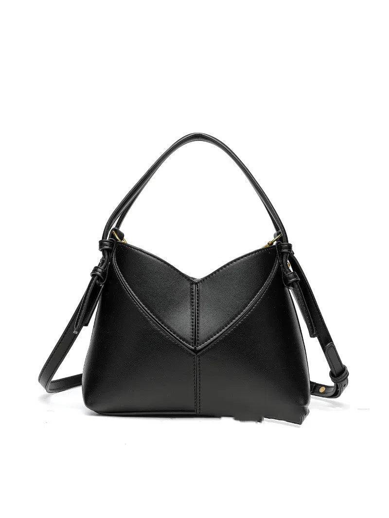 Women's oval PU handbag crossbody bag in black with stitched design and single shoulder strap