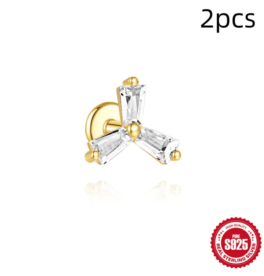 S925 sterling silver stud earring with golden double piercing design and zircon inlaid detail on a white background.