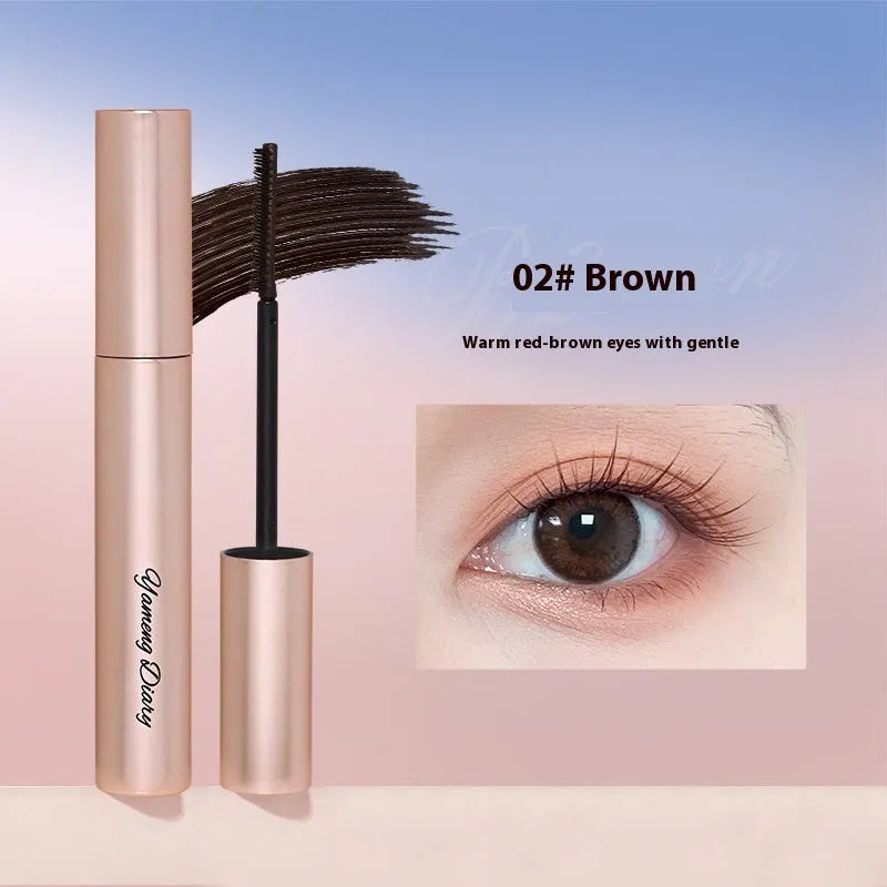 Long curling mascara tube with applicator brush in black or brown colour options for eyelash definition